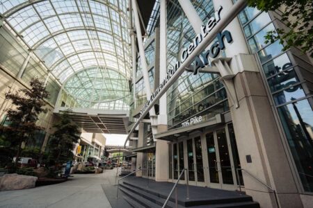 Entranceway to the Seattle Convention Center, featuring a glass arch that stretches over the street.