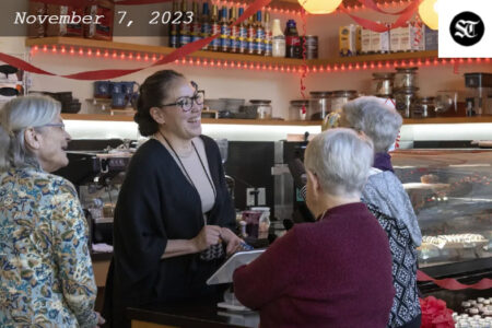 Leila Perez, cafe manager at ʔálʔal Café in Seattle’s Pioneer Square, (second from left) takes orders from customers last August. Perez is a member of the Tlingit and Haida tribes. ʔálʔal Cafe is celebrating its one-year anniversary.