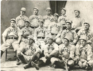 A black and white photo of a baseball team showing 15 men lined up in 3 rows.