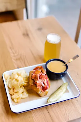 Make your roll a combo! Add on a lobster bisque and local draft beer to your lobster roll